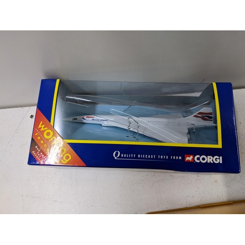 32 - A collection of die cast model vehicles and aircraft to include a boxed Corgi, Concorde, a Polistick... 