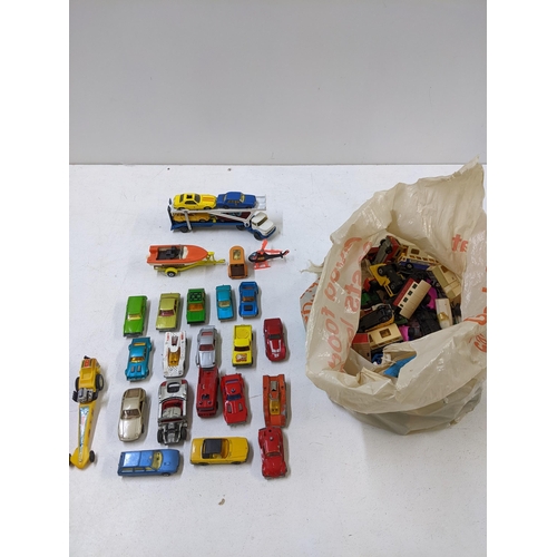 33 - A collection of unboxed die cast model vehicles to include a Corgi Juniors Mercedes car transporter ... 