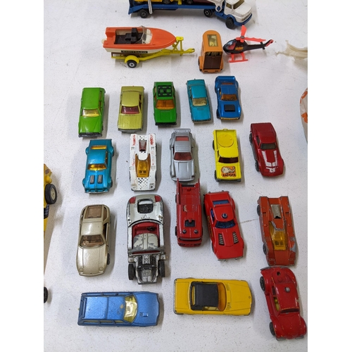 33 - A collection of unboxed die cast model vehicles to include a Corgi Juniors Mercedes car transporter ... 