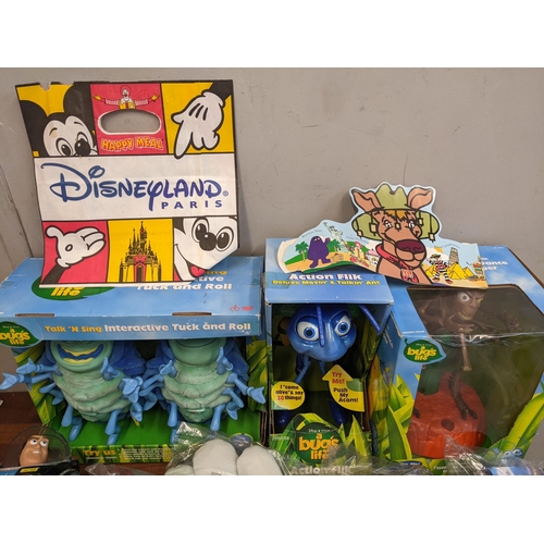 74 - A collection of Disney themed toys to include a Bugs Life talk n sing interactive tuck and roll, var... 