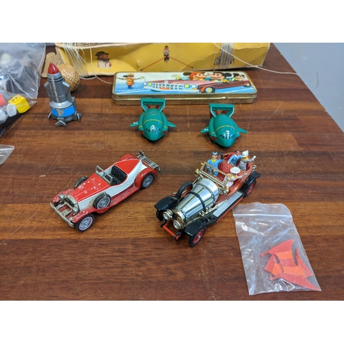 75 - A collection of toys to include Smurf related McDonalds Happy Meal toys, a Corgi toys Chitty Chitty ... 