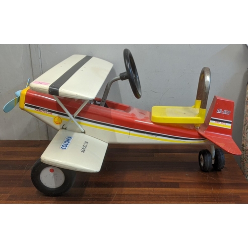 78 - A red, black, white and yellow Colma pastor ride on childs aeroplane
Location:A2B
If there is no con... 