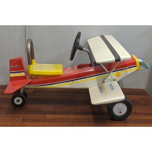 78 - A red, black, white and yellow Colma pastor ride on childs aeroplane
Location:A2B
If there is no con... 