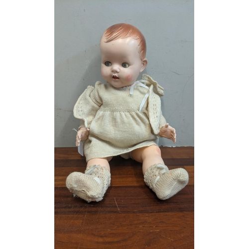 80 - A 1950s dolls pedigree with jointed arms & legs blue sleeping eyes and open mouth in original clothe... 