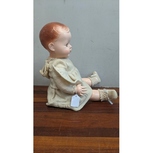 80 - A 1950s dolls pedigree with jointed arms & legs blue sleeping eyes and open mouth in original clothe... 