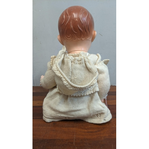 80 - A 1950s dolls pedigree with jointed arms & legs blue sleeping eyes and open mouth in original clothe... 