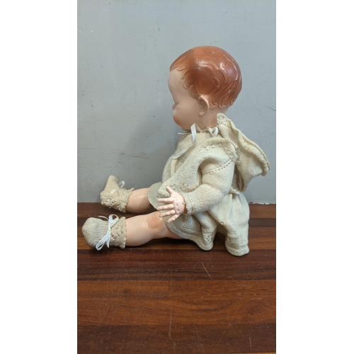 80 - A 1950s dolls pedigree with jointed arms & legs blue sleeping eyes and open mouth in original clothe... 