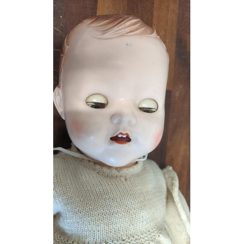 80 - A 1950s dolls pedigree with jointed arms & legs blue sleeping eyes and open mouth in original clothe... 