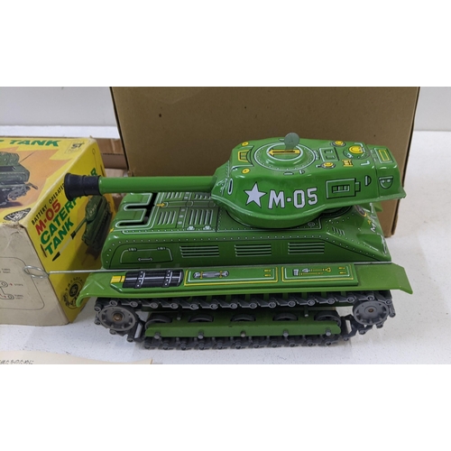 94 - A masudaya battery operated M-0S caterpillar tank in its original box and packaging 
Location:ROS
If... 