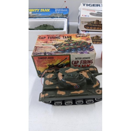 99 - Boxed model tanks to include two tamiya Tiger 1 tanks both incomplete, two Russian T-34-85's a Marx ... 