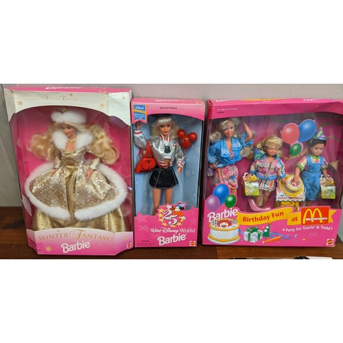 76 - A collection of boxed Barbie dolls to include limited edition winter fantasy, Walt Disney world Barb... 