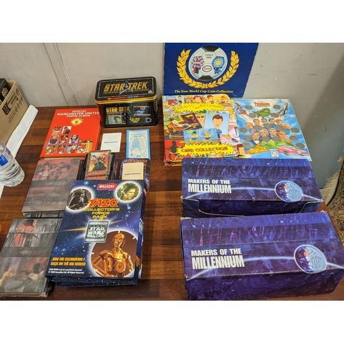 77 - A mixed lot of collectable items to include a tin of Star Trek first edition metal collectors cards,... 