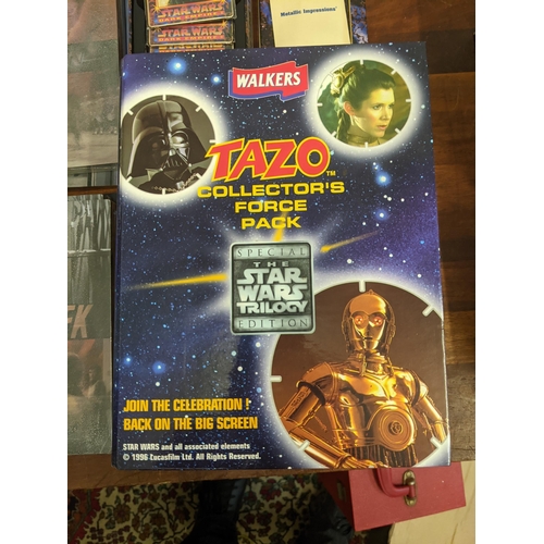 77 - A mixed lot of collectable items to include a tin of Star Trek first edition metal collectors cards,... 