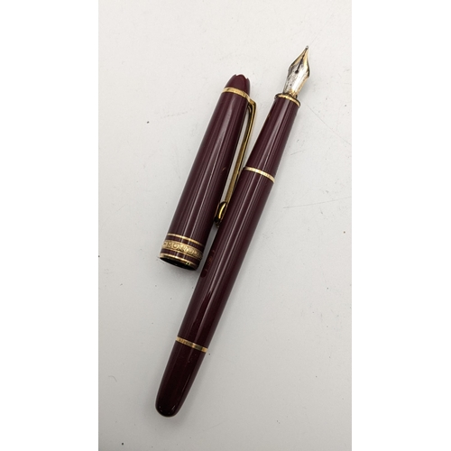 8 - A burgundy Mont Blanc Meisterstuck fountain pen with original case, box and service warranty certifi... 