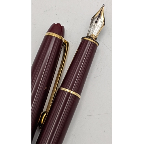 8 - A burgundy Mont Blanc Meisterstuck fountain pen with original case, box and service warranty certifi... 