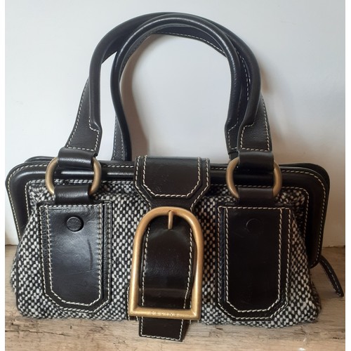 9 - Celine- A black and white woollen tweed 'Ella Frame' handbag and matching shoes, the bag having blac... 