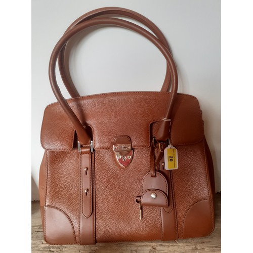 20 - Aspinal of London-A mid brown leather handbag having gold tone hardware with lock fastening and key,... 