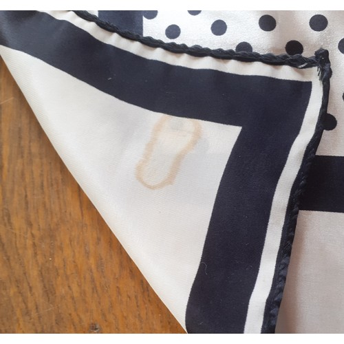 32 - Aspinal of London-A silk scarf having a design of black polka dots on a white ground with black stri... 