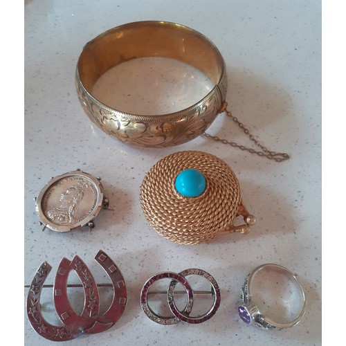 70 - A selection of vintage costume jewellery to include 2 Victorian white metal brooches, an engraved go... 