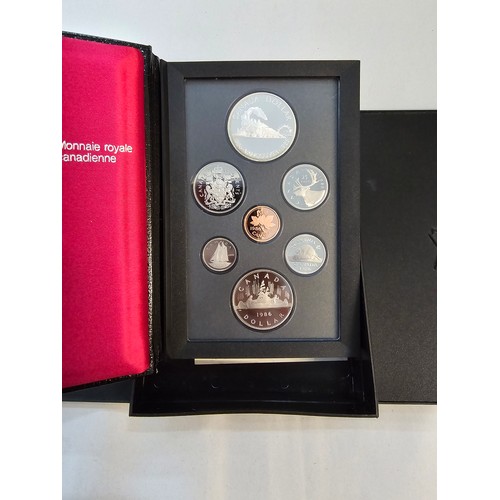 146 - Canada - 1986 and 1988 Proof Sets each comprising of 7 coins and having a Silver Dollar eachLocation... 