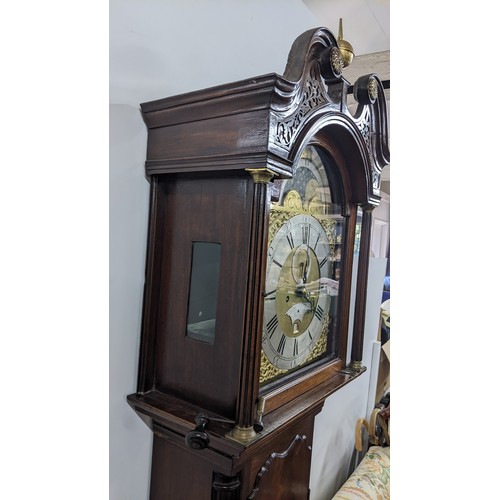 89 - A George III Mahogany 8 day longcase clock, the case having a broken swan neck pediment with pierced... 