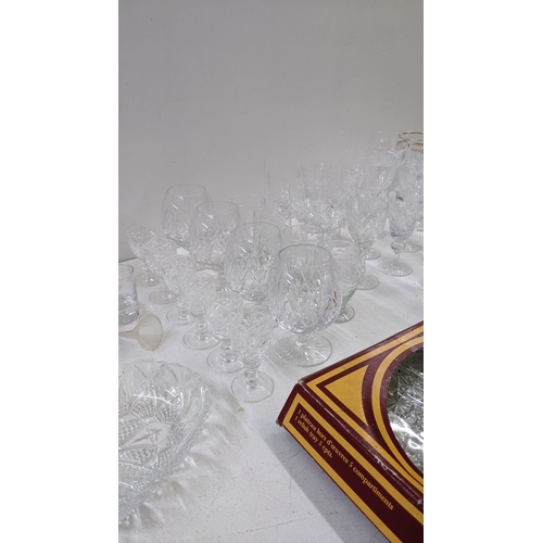 417 - A mixed lot to include a collection of crystal cut glassware to include brandy glasses, sherry glass... 