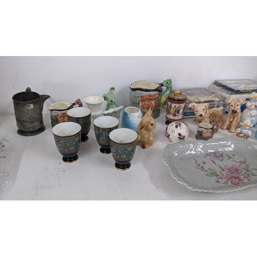 436 - A mixed lot to include an Indonesian chess set, Chinese related books, character mugs, selection of ... 