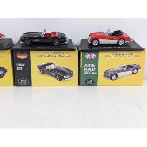 127 - Five Atlas Edition boxed cars to include an Aston Martin DB5, a BMW 507, a Jaguar E-Type and an Aust... 