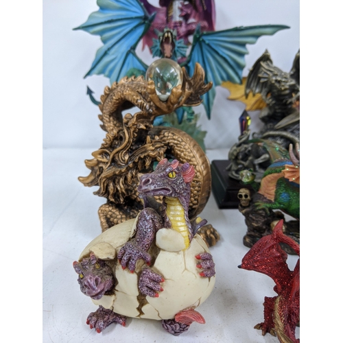 128 - Models of Dragons and fantasy creatures to include a purple limited edition Trigador worked around a... 