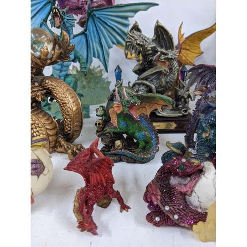 128 - Models of Dragons and fantasy creatures to include a purple limited edition Trigador worked around a... 