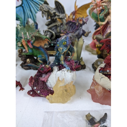 128 - Models of Dragons and fantasy creatures to include a purple limited edition Trigador worked around a... 