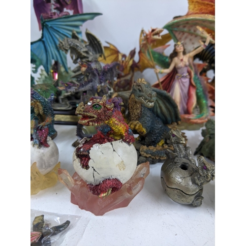 128 - Models of Dragons and fantasy creatures to include a purple limited edition Trigador worked around a... 