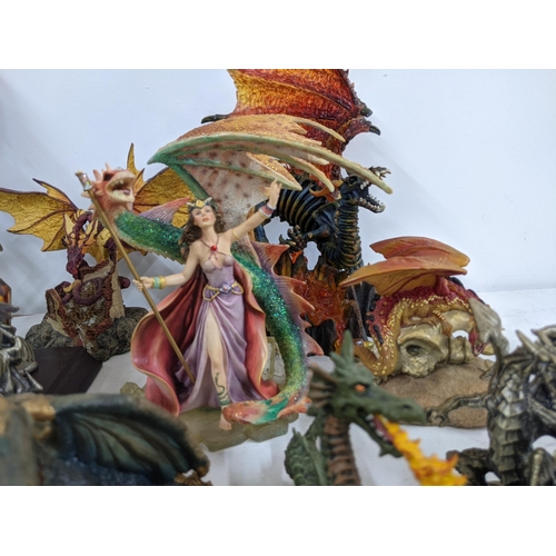 128 - Models of Dragons and fantasy creatures to include a purple limited edition Trigador worked around a... 