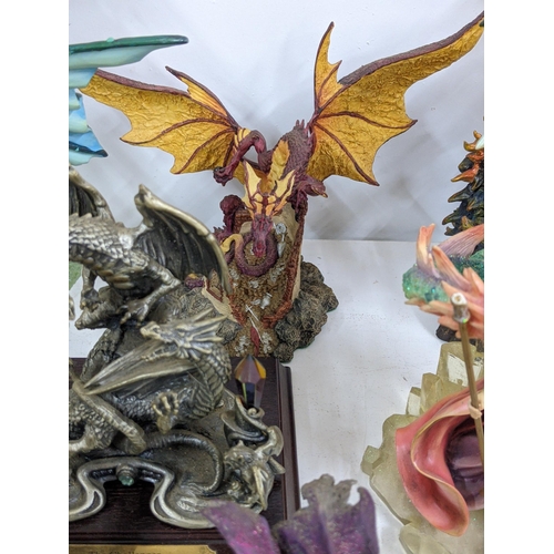 128 - Models of Dragons and fantasy creatures to include a purple limited edition Trigador worked around a... 