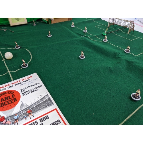 130 - A collection of Subbuteo including teams, pitches, and a range of original instructions and brochure... 