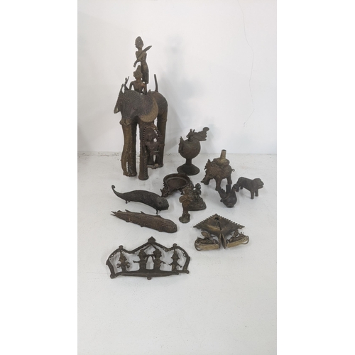 400 - Early 20th century and later African and Indian items to include a brass statue of a tribal man seat... 