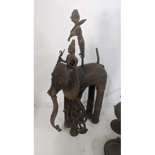 400 - Early 20th century and later African and Indian items to include a brass statue of a tribal man seat... 