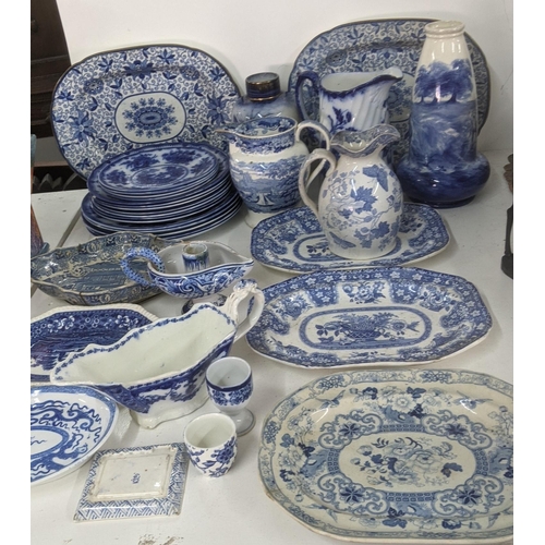 434 - Mainly 19th century blue and white ceramics to include a gravy boat, platters, masonic candlestick h... 