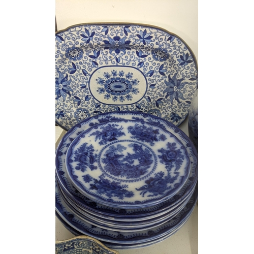 434 - Mainly 19th century blue and white ceramics to include a gravy boat, platters, masonic candlestick h... 