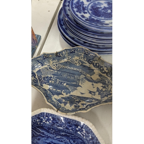 434 - Mainly 19th century blue and white ceramics to include a gravy boat, platters, masonic candlestick h... 