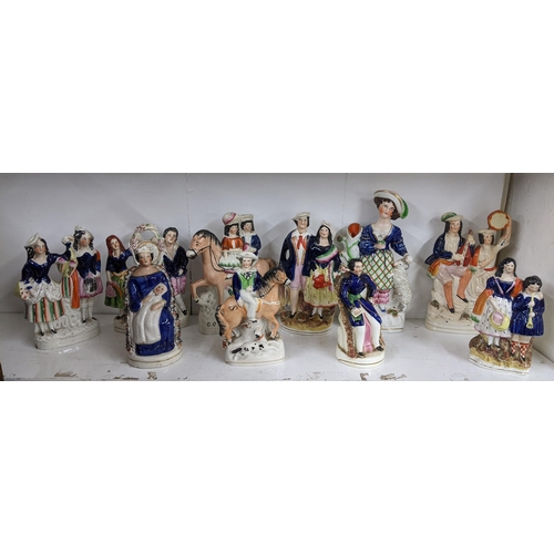 449 - A collection of 19th century Staffordshire and later Staffordshire style flatback figures to include... 