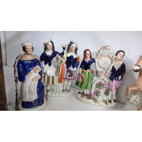 449 - A collection of 19th century Staffordshire and later Staffordshire style flatback figures to include... 