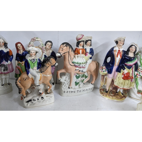 449 - A collection of 19th century Staffordshire and later Staffordshire style flatback figures to include... 