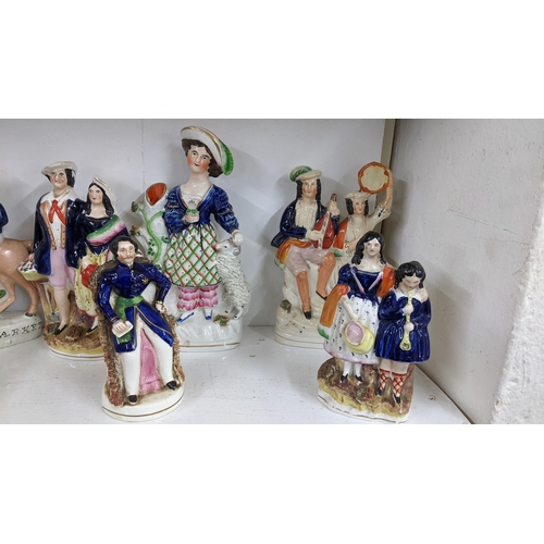 449 - A collection of 19th century Staffordshire and later Staffordshire style flatback figures to include... 