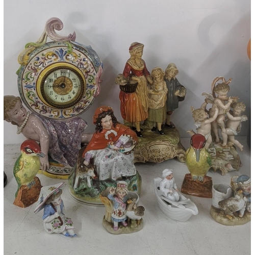 455 - A mixed lot of figural ornaments to include an Italian mantel clock and others
Location: A1F
If ther... 