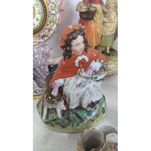 455 - A mixed lot of figural ornaments to include an Italian mantel clock and others
Location: A1F
If ther... 