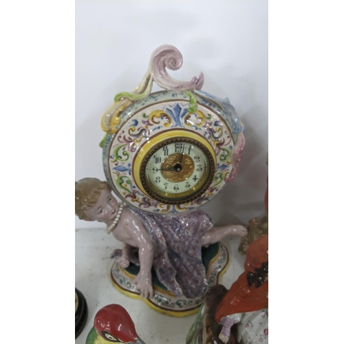 455 - A mixed lot of figural ornaments to include an Italian mantel clock and others
Location: A1F
If ther... 