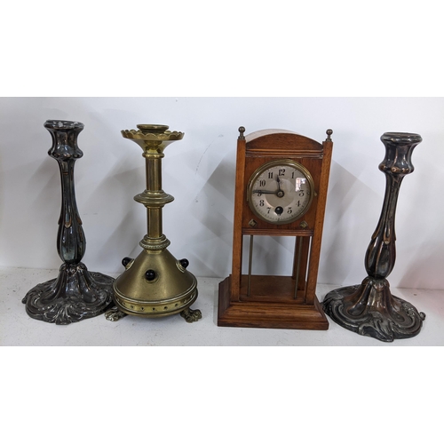 469 - A mixed lot to include an early 20th century Junghans clock, gilt candlestick inset with red cabocho... 