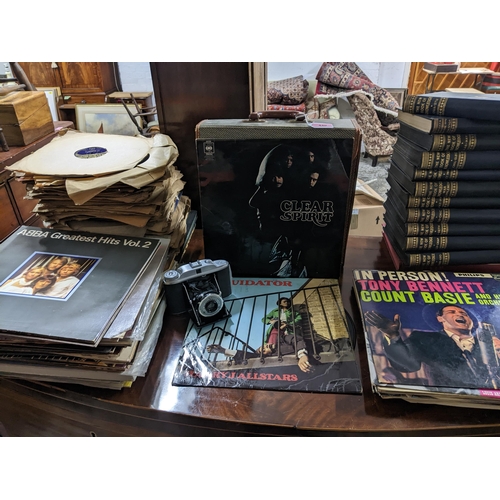 440 - A mixed lot of 78rpm and LP records, set of encyclopaedias and a Kershaw 110 folding film camera, to... 