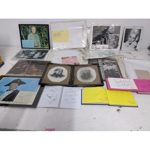 441 - A quantity of movie and sporting autograph memorabilia to include three autograph books, various pic... 